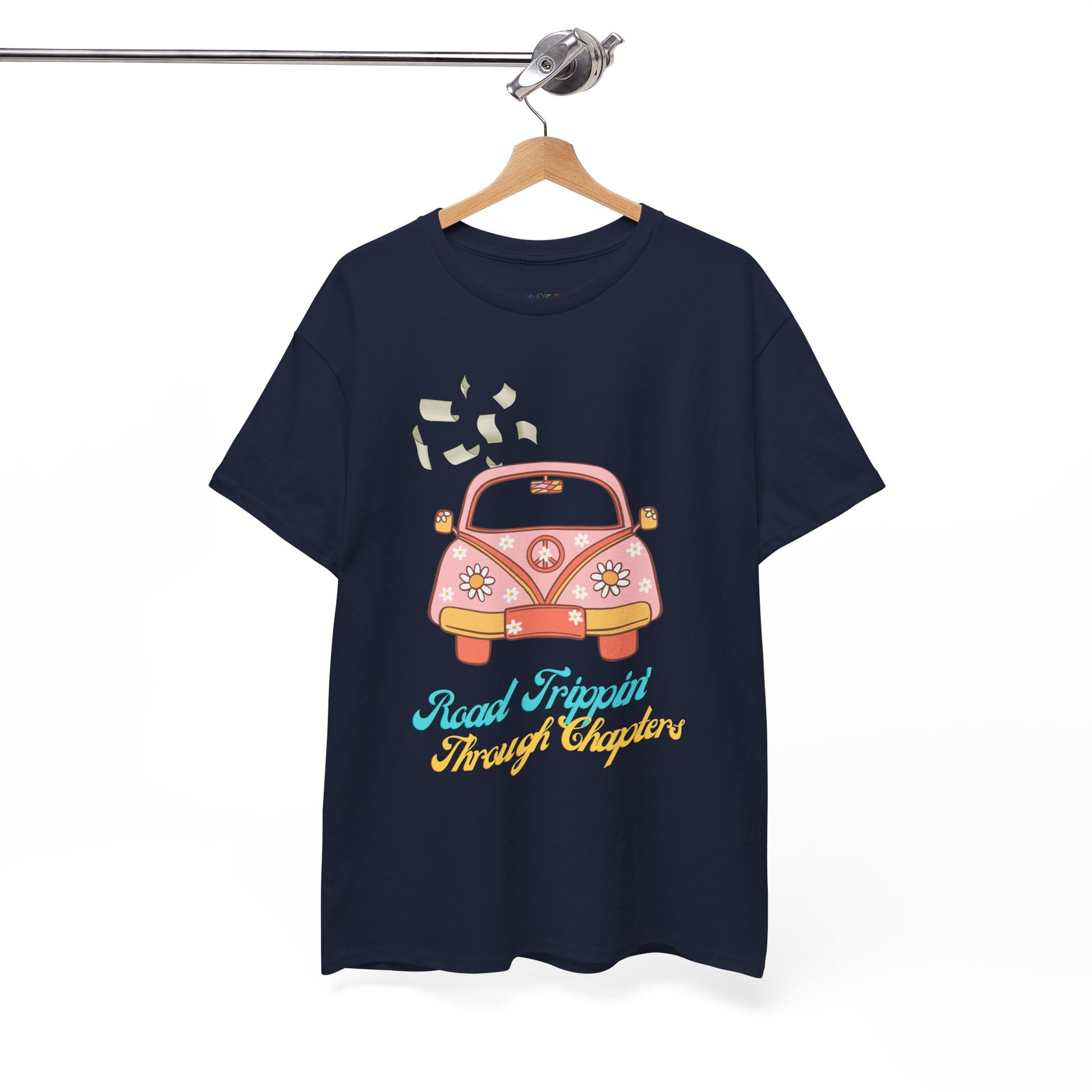 Navy blue t-shirt with a retro pink car , pages flying out the windows and text 'Road Tripping Through Chapters' 