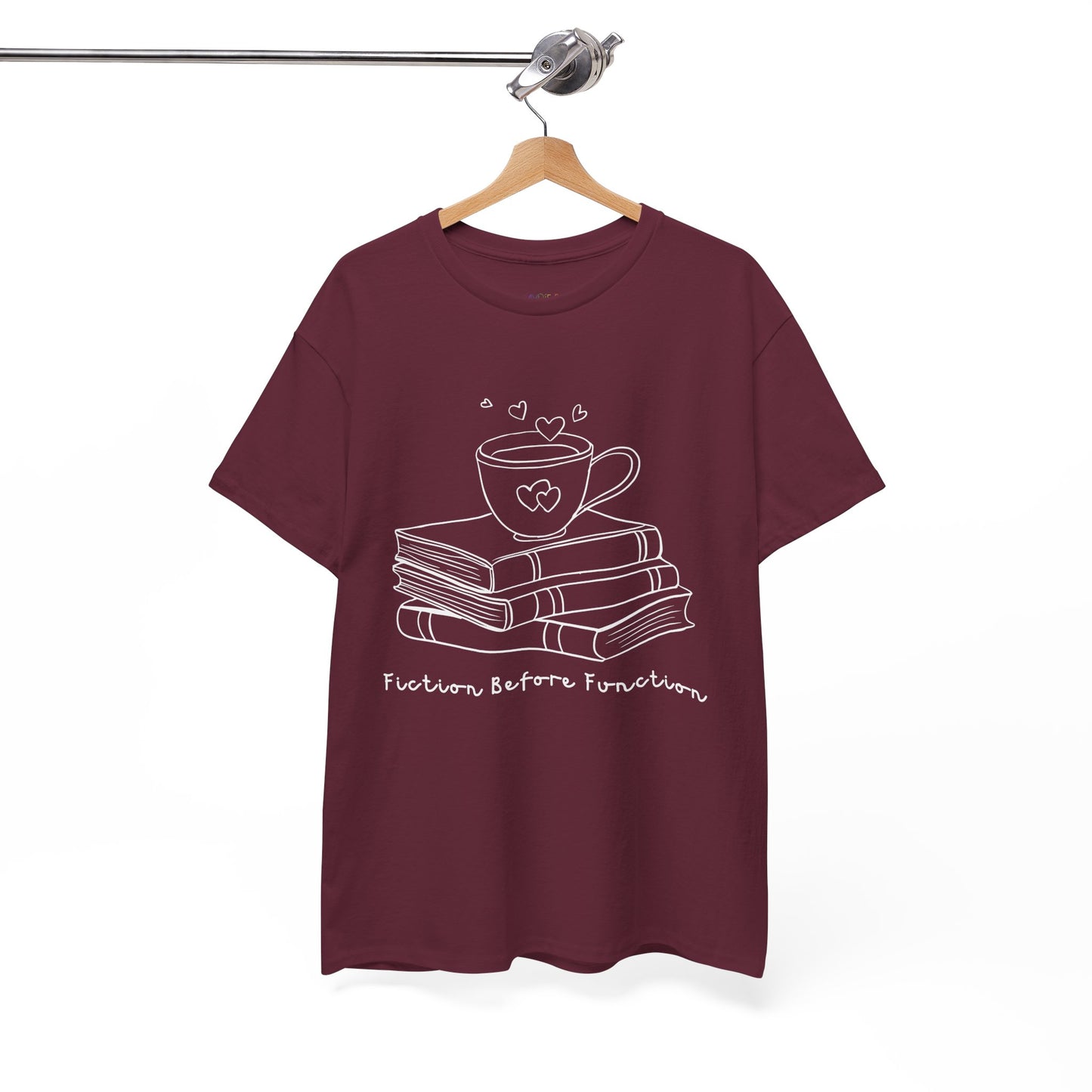 Maroon t-shirt with white graphic design of hot beverage and a stack of books, text 'Fiction Before Function' 