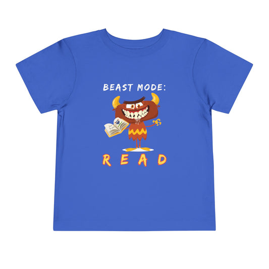 Blue toddler t-shirt with a drooling cartoon monster holding a book and text 'Beast Mode: Read' 