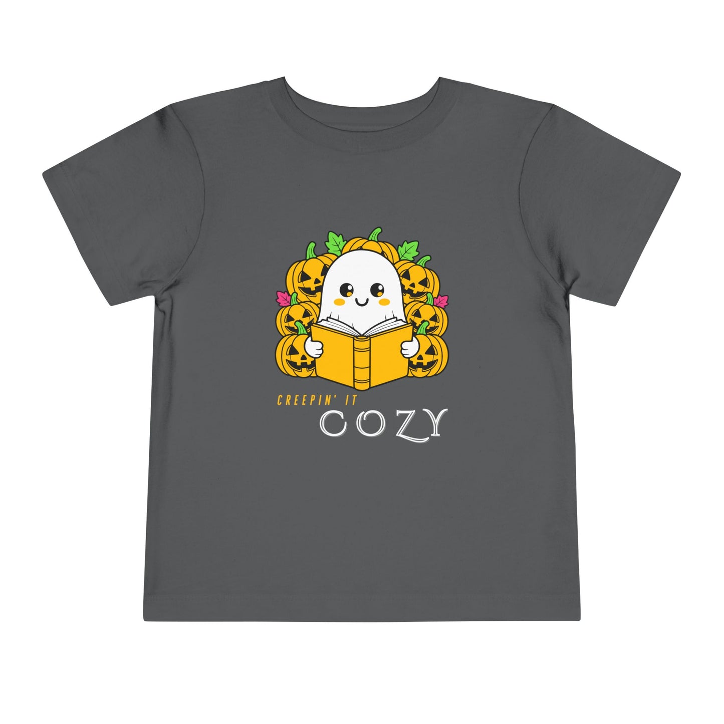 Gray toddler t-shirt with a ghost reading a book in pumpkin patch and text 'Creepin' It Cozy'