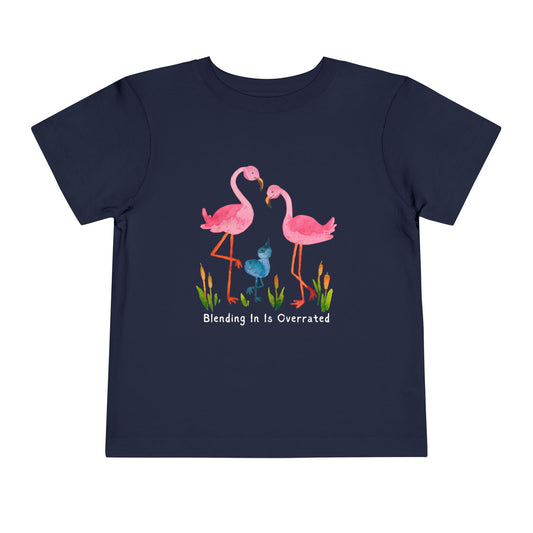 Navy blue toddler t-shirt with pink flamingo family and text 'Blending In Is Overrated'