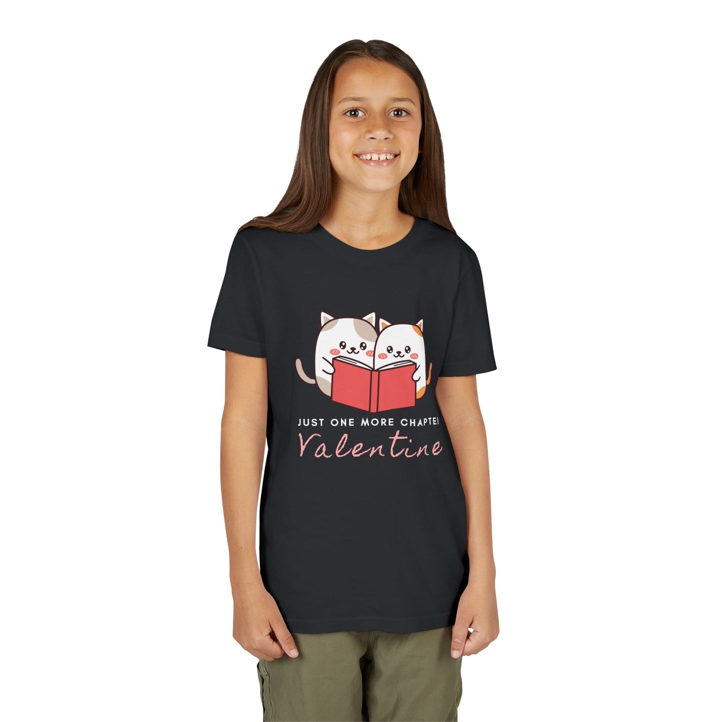 Girl wearing a black t-shirt with two cartoon cats reading a book and 'Just One More Chapter Valentine' text 