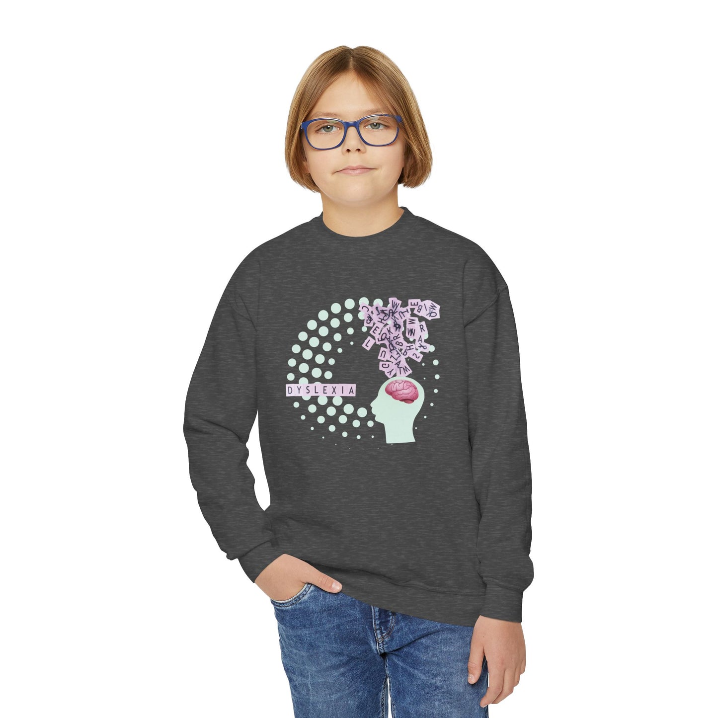 Boy wearing a dark gray sweatshirt with a spiral dot graphic, and jumbled letters above a brain, with text 'Dyslexia'