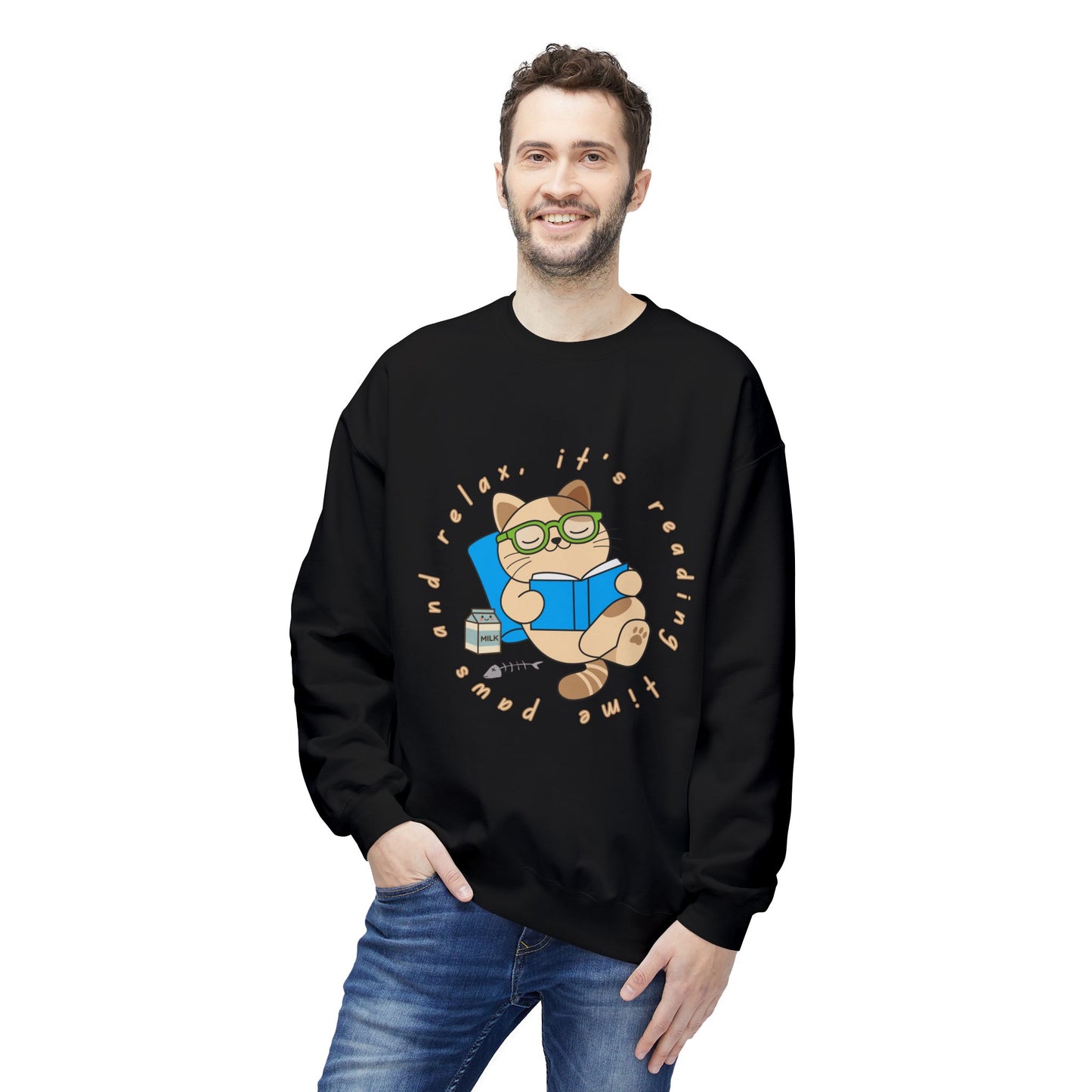 Man wearing a black sweatshirt with a cat reading a book graphic and text 'Paws and relax, it's reading time'