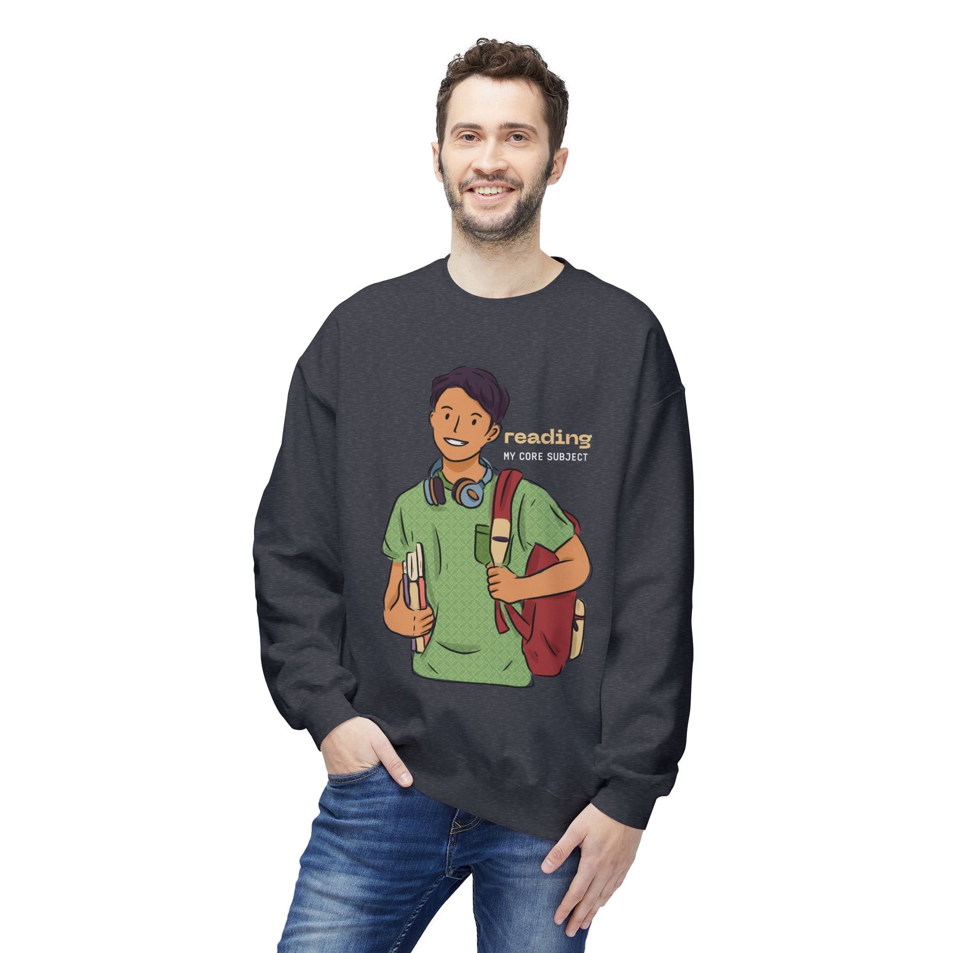 Man wearing a grey sweatshirt with a graphic of a person holding books and a backpack, with 'reading my core subject' text.