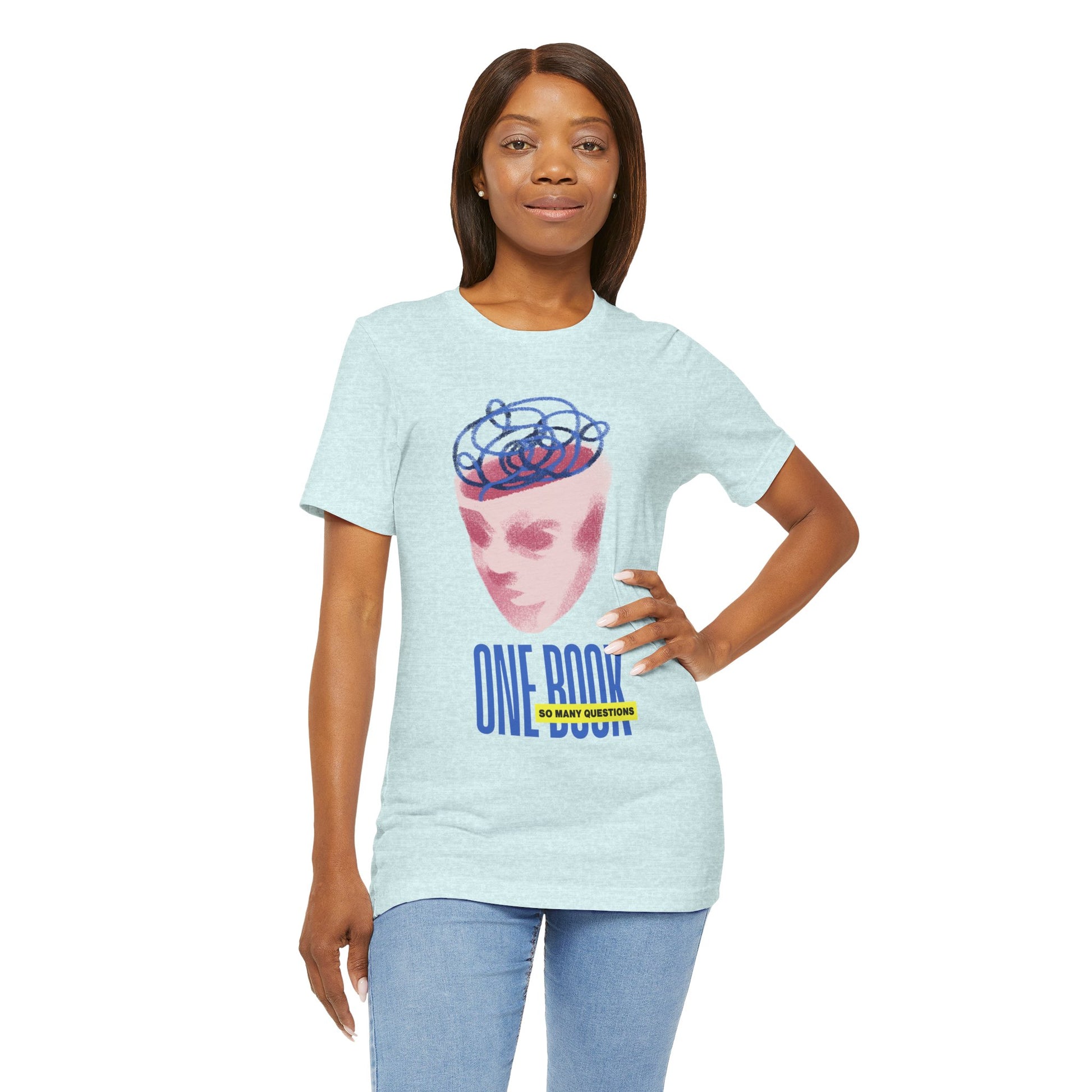 Woman wearing a light ice blue t-shirt with a pink face/head graphic, blue swirls coming out of the top and text 'One Book So Many Questions'