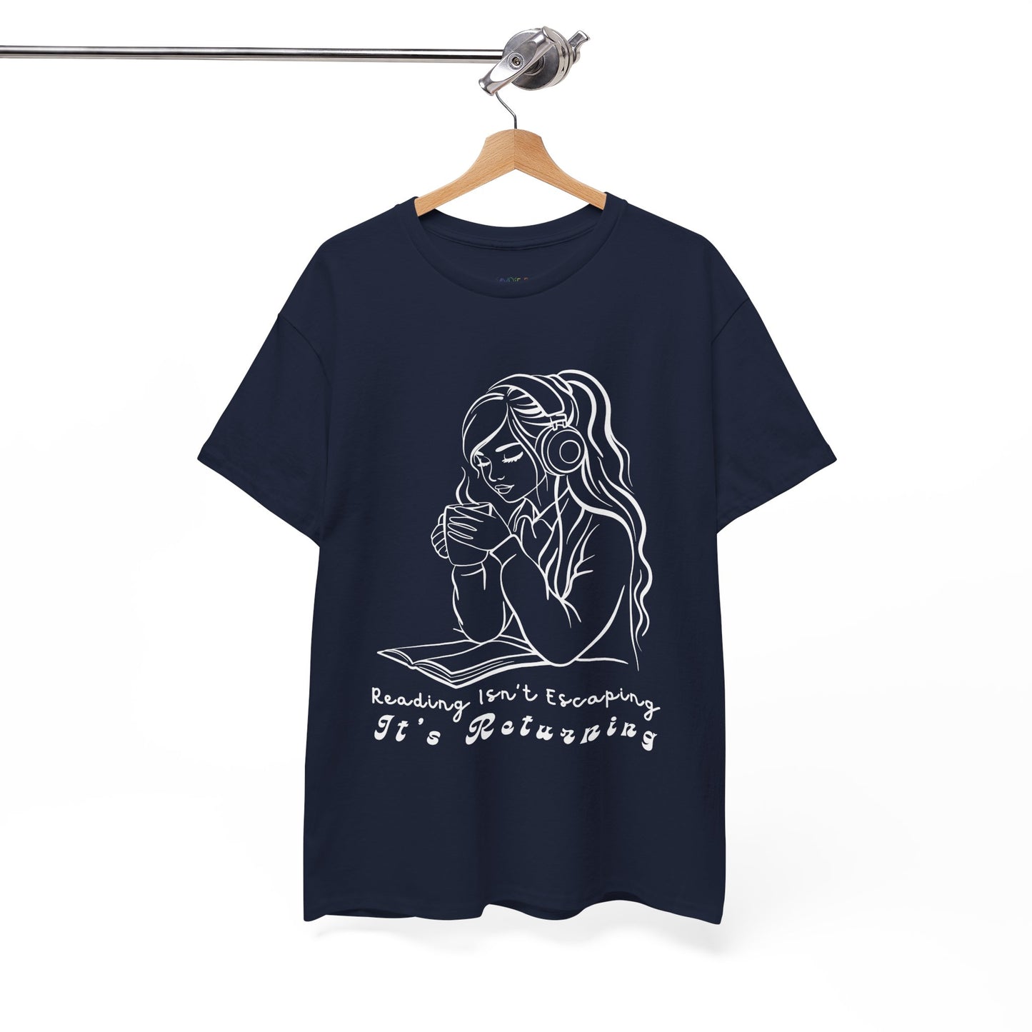 Navy blue t-shirt with a woman wearing headphones, cupping a hot beverage and reading a book, text 'Reading Isn't Escaping, It's Returning'