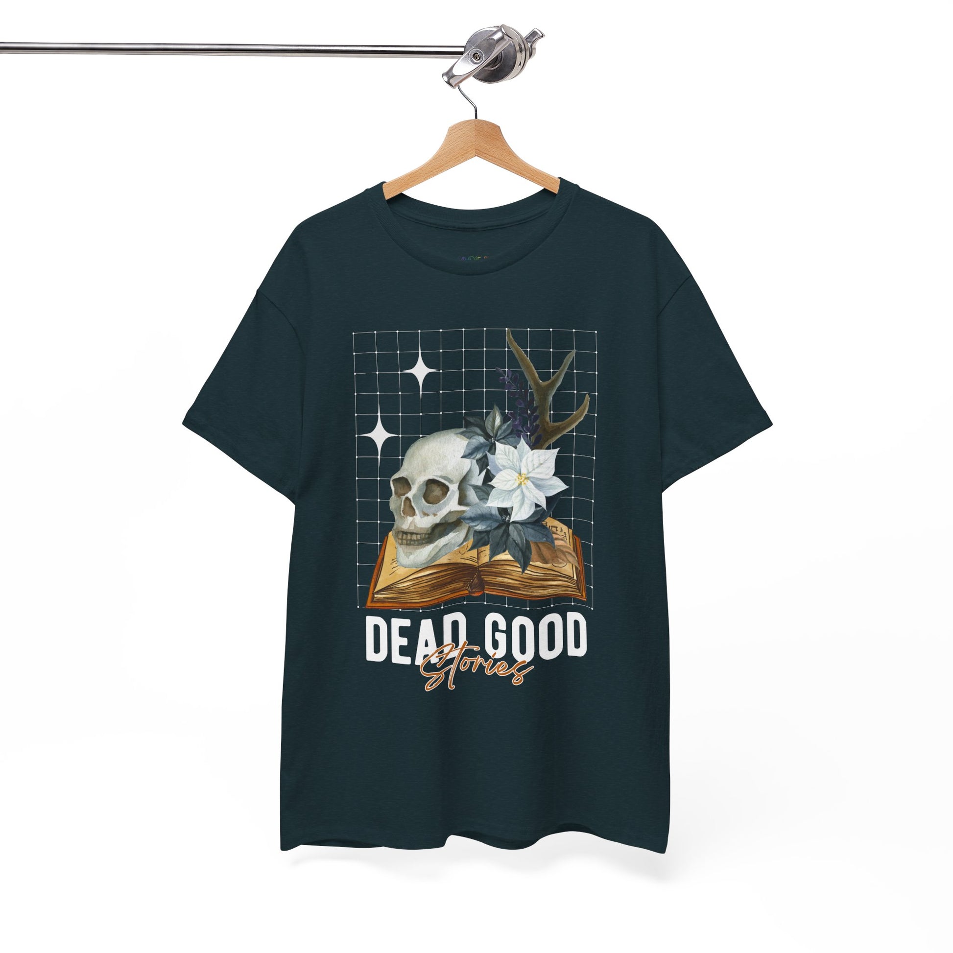Midnight t-shirt with skull, antler, and flower on a book with text 'Dead Good Stories' on a hanger against a white background
