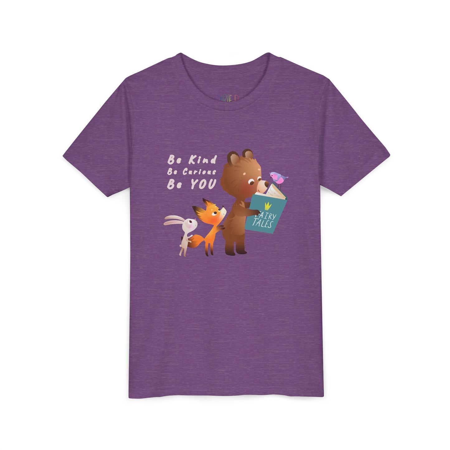 Light purple t-shirt with cartoon animals reading a fairy tales book and text 'Be Kind. Be Curious. Be YOU.'