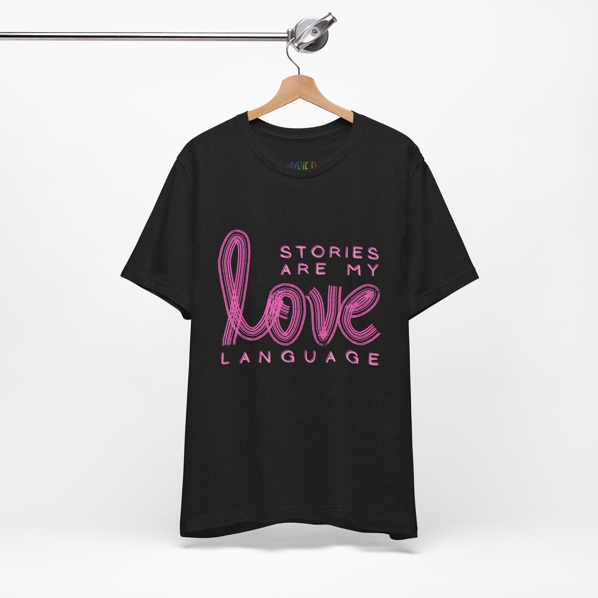 Black t-shirt with pink text 'Stories Are My Love Language'