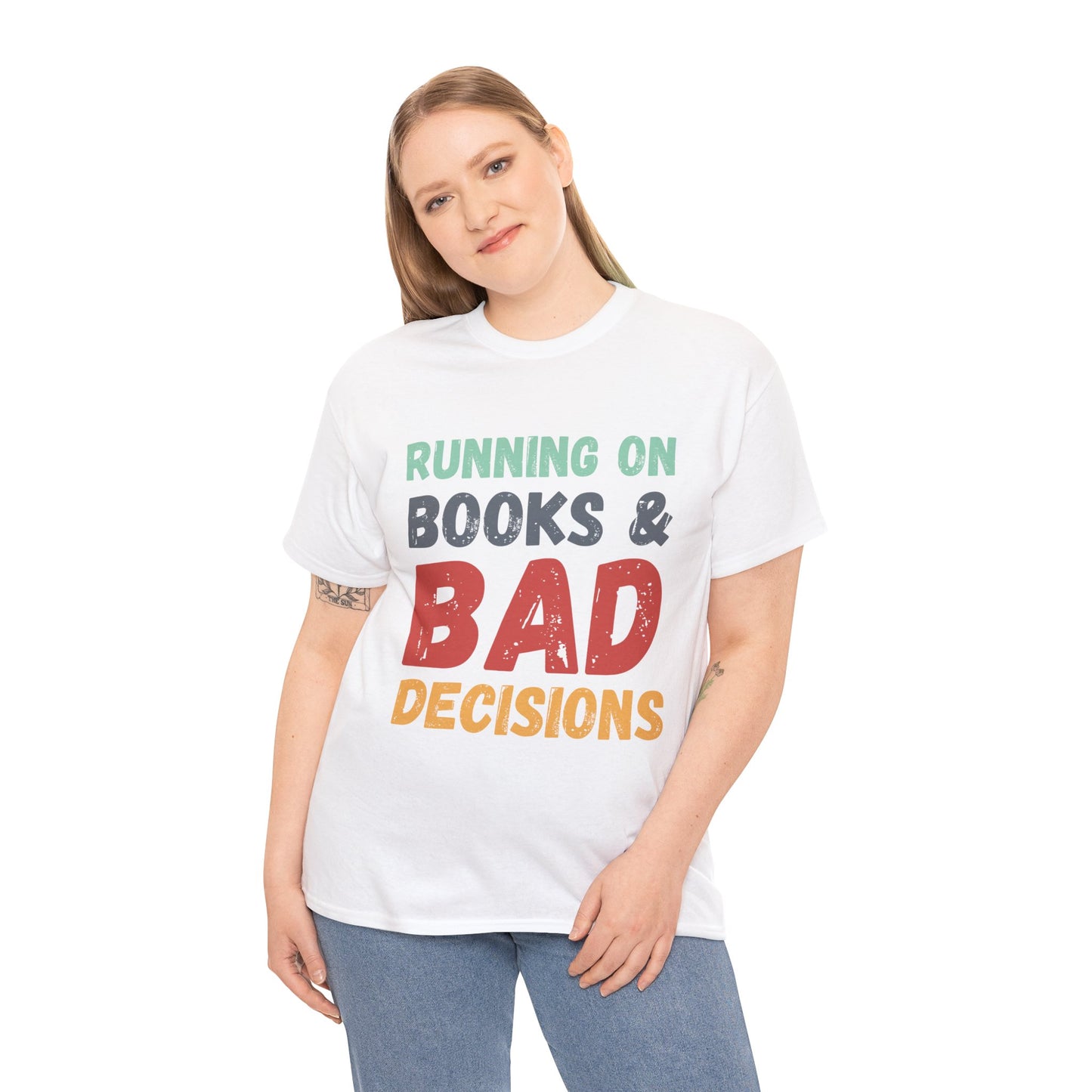 Woman wearing a white t-shirt with colorful retro text 'Running on Books & Bad Decisions' 