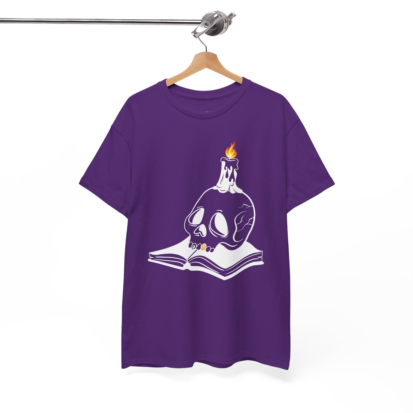 Purple t-shirt with a graphic design of a skull and candle on an an open book