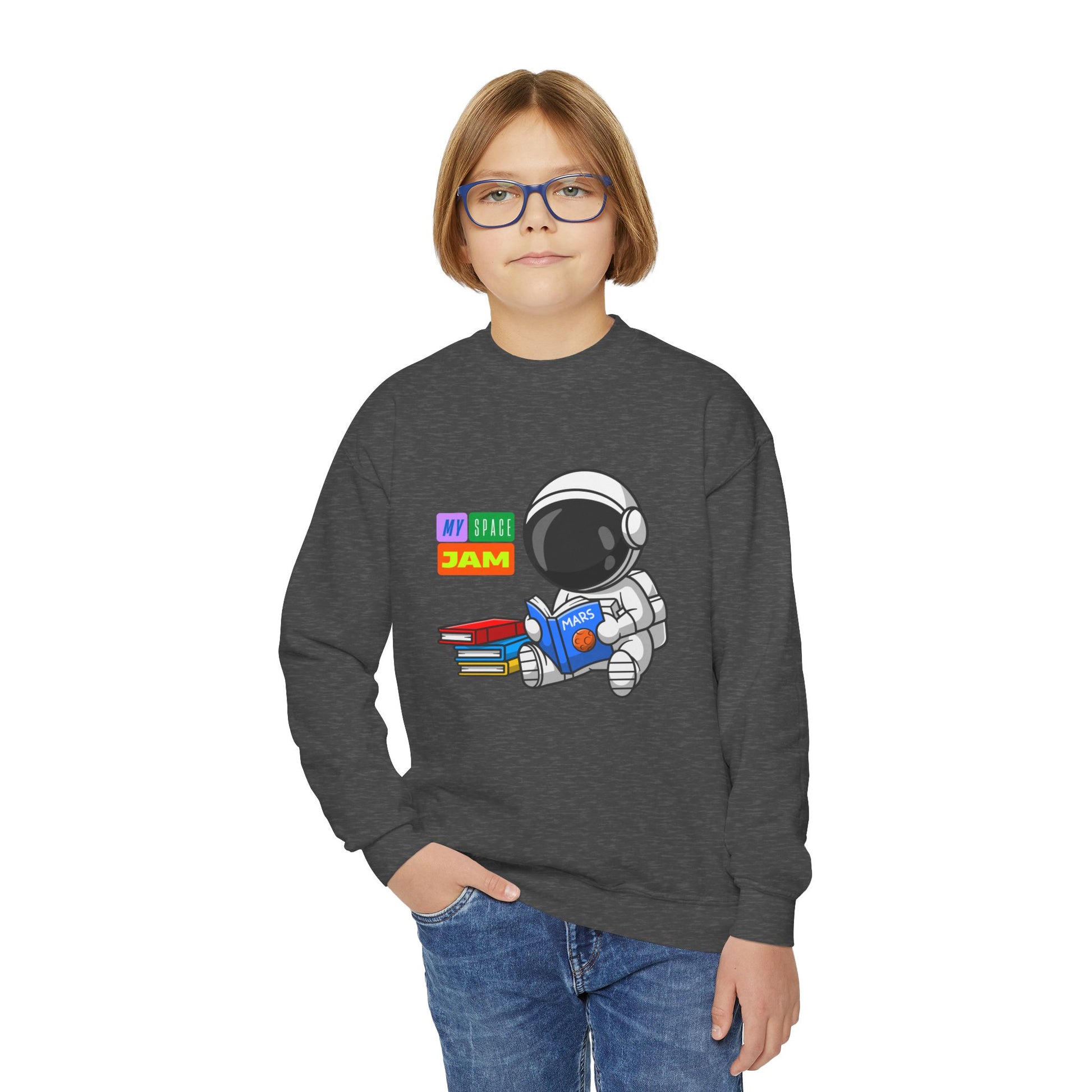 Boy wearing a dark gray sweatshirt with an astronaut reading a book and text 'my space jam'