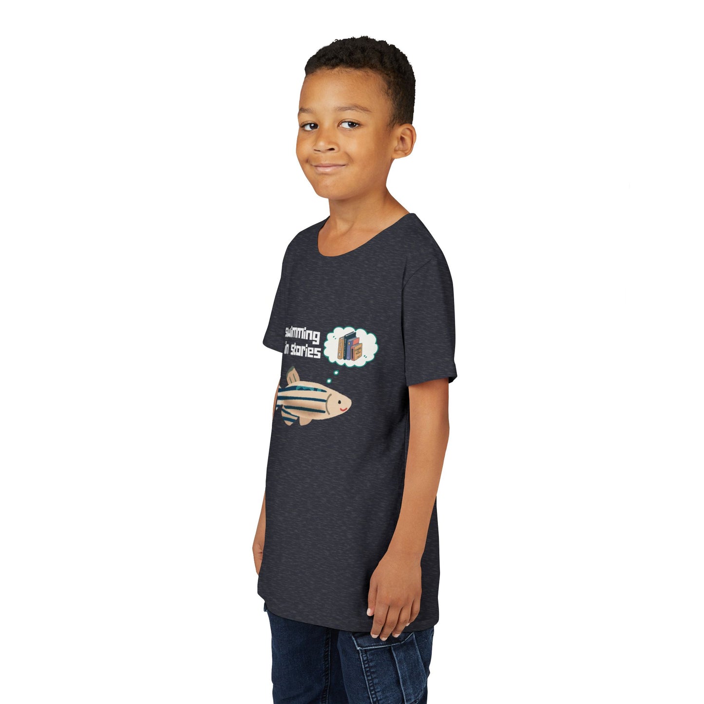 Boy wearing a navy blue t-shirt with a fish graphic and text 'swimming in stories' 