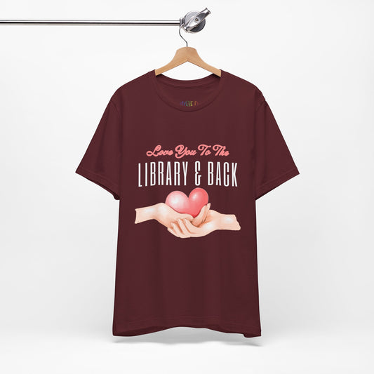 Maroon t-shirt with graphic design of two hands holding a heart and text 'Love You To The Library & Back' 