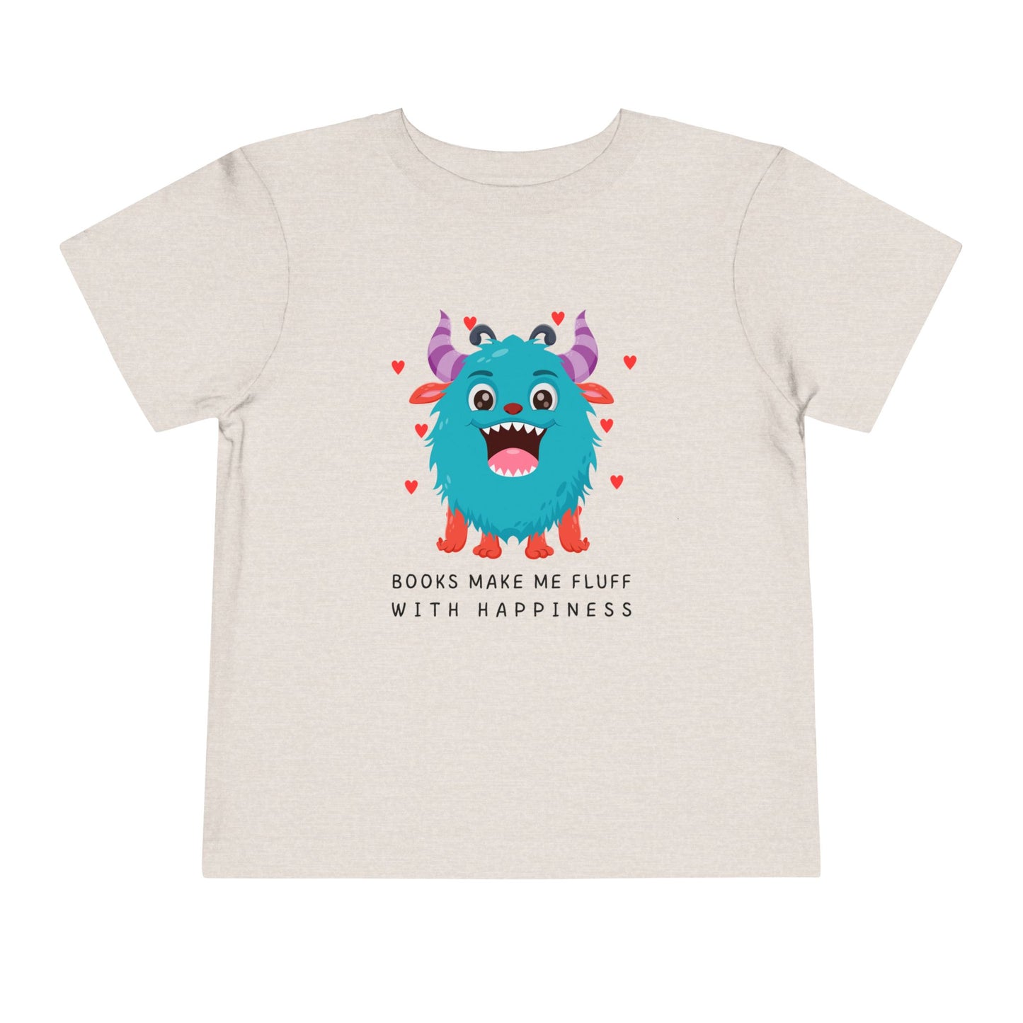 Beige toddler t-shirt with a fluffy blue monster graphic, floating hearts and text 'Books Make Me Fluff With Happiness' on a white background