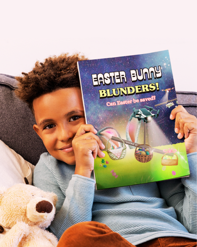 Child holding a book titled 'Easter Bunny Blunders!' by Jaybie D. with a teddy bear on a couch.